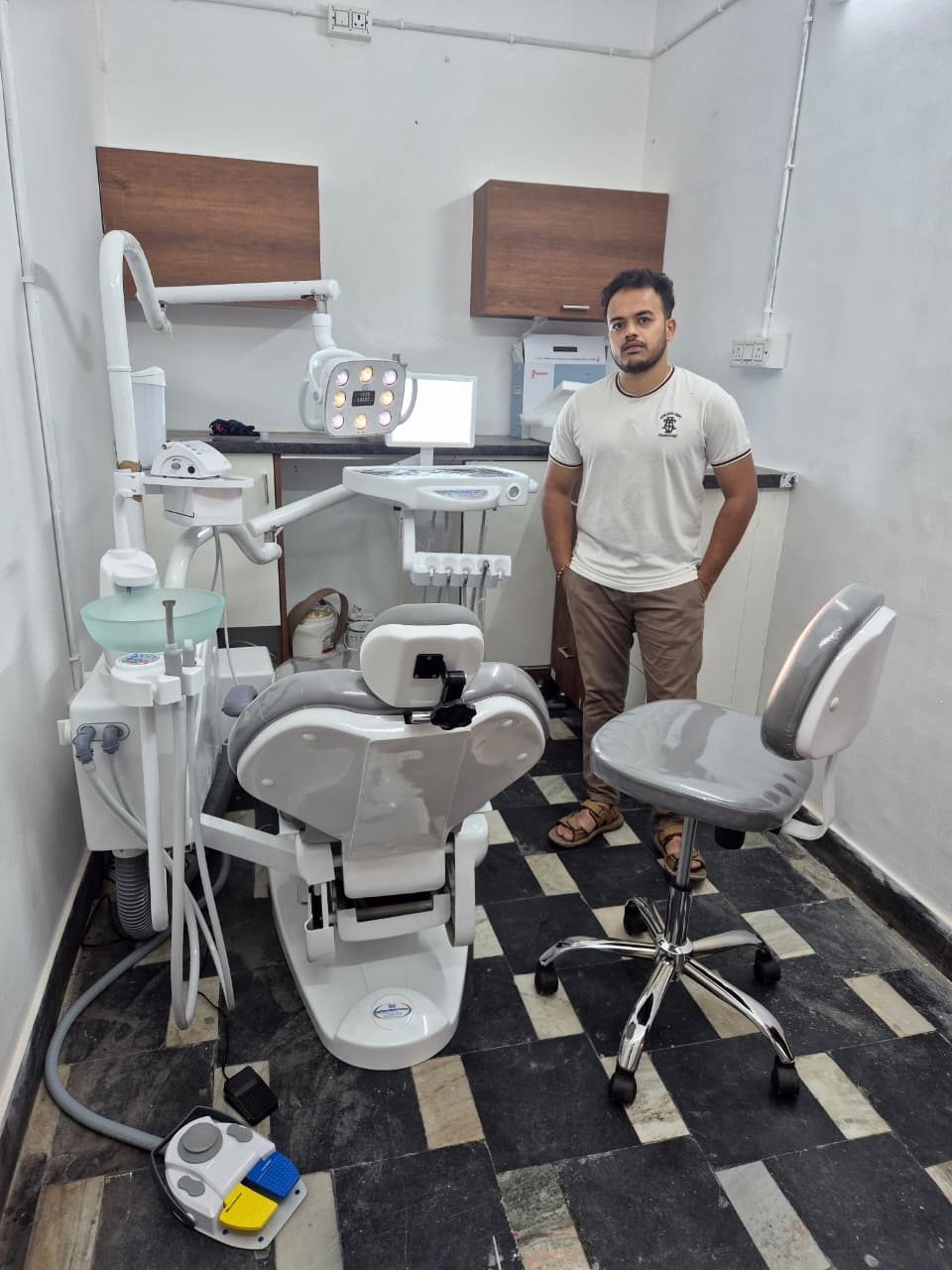 Dr. Nehal with dental equipment